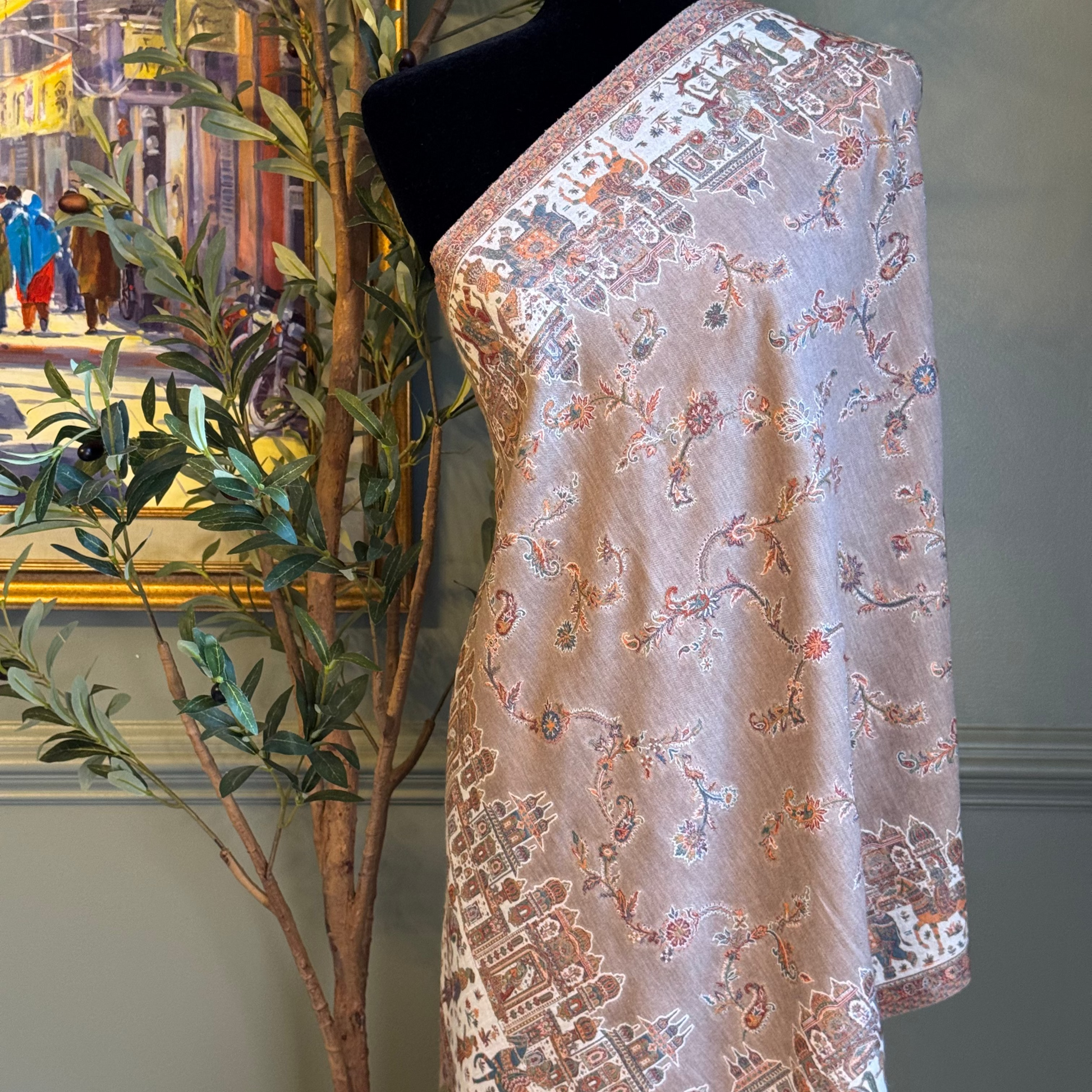 Embroidered fabric on a mannequin with a decorative background