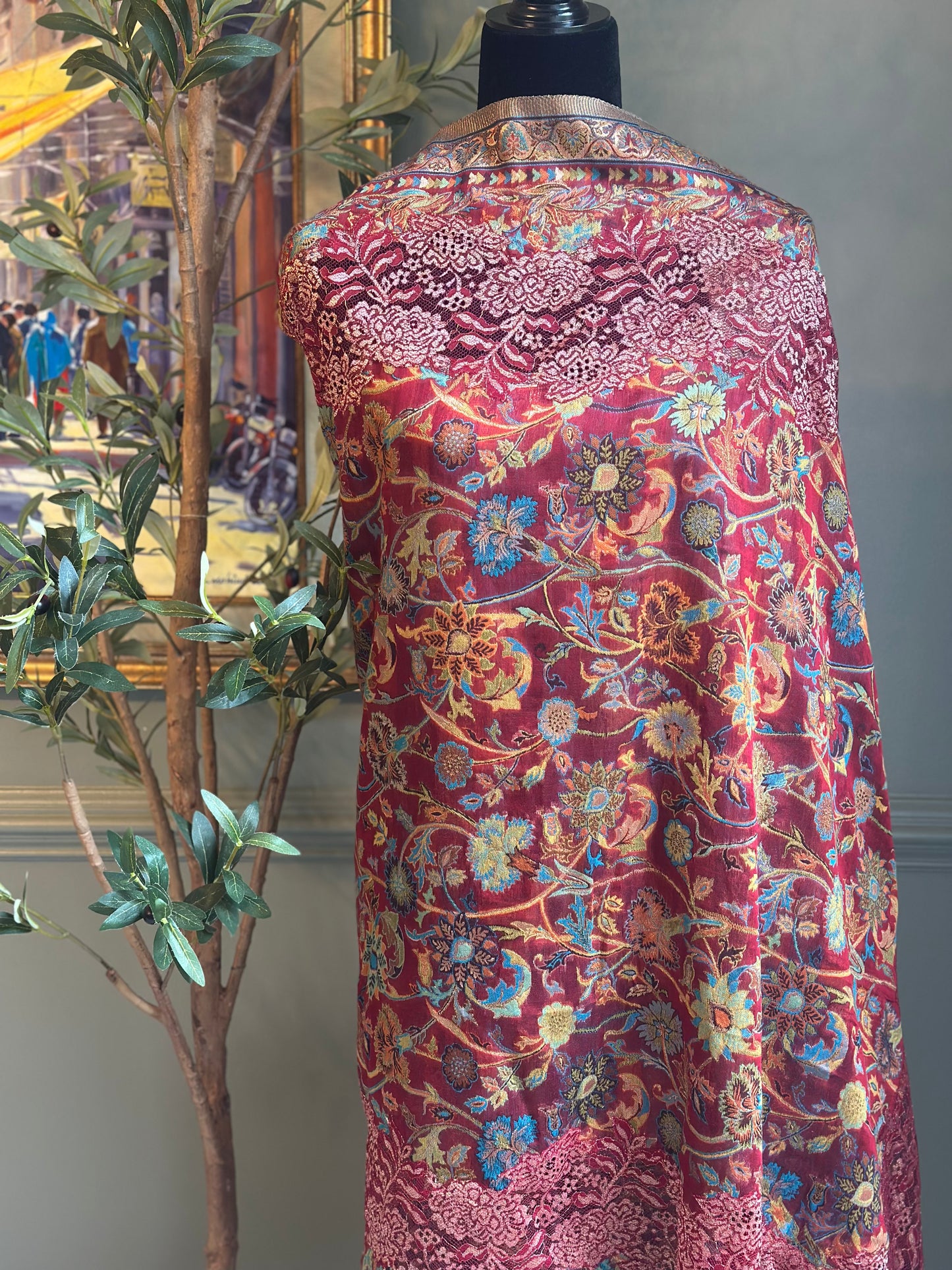 Colorful patterned fabric on a mannequin with an indoor background